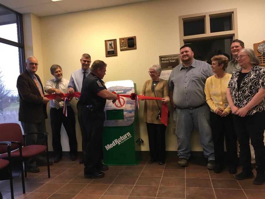 image of people doing a ribbon cutting